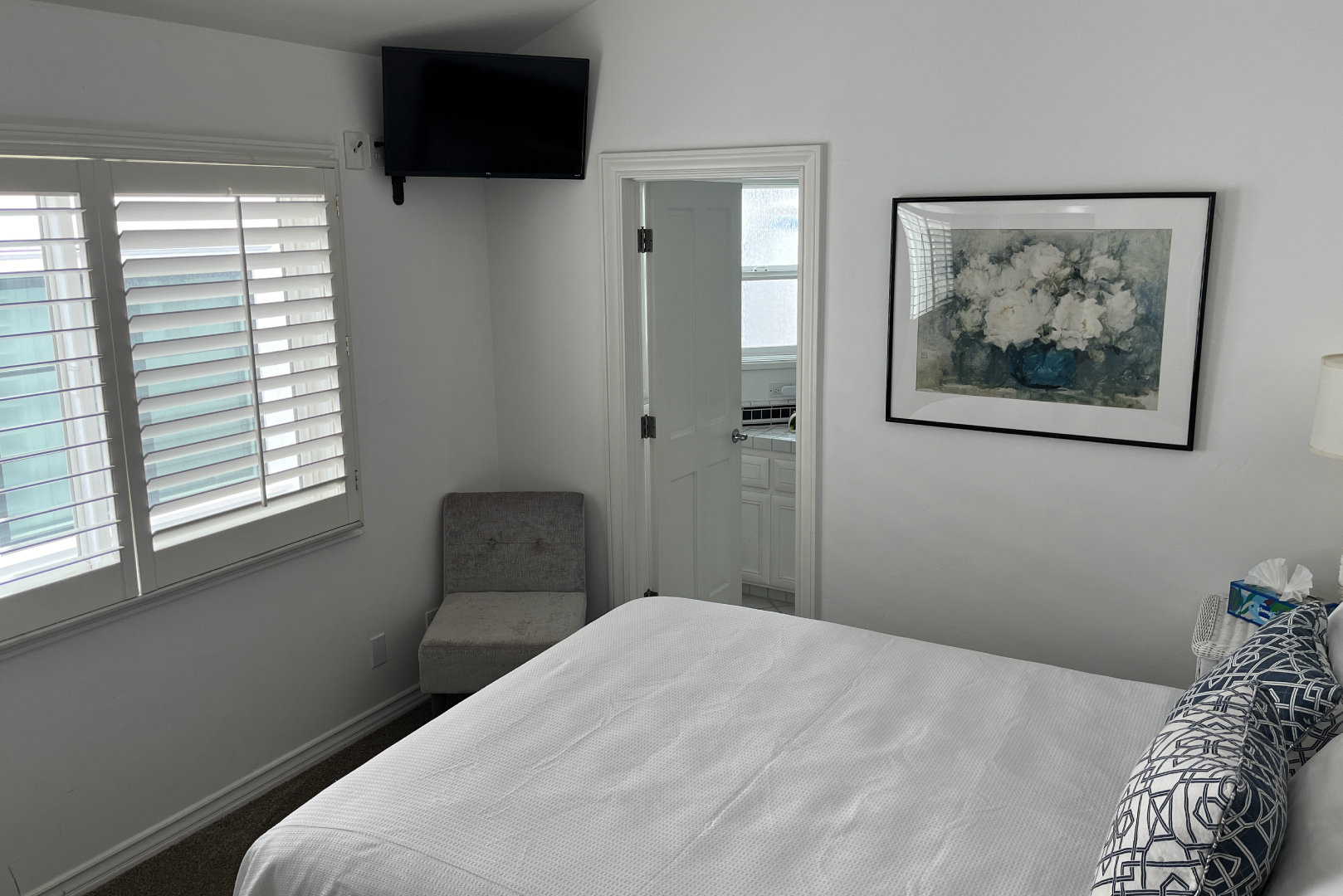 The 2nd guest room contains a queen sized bed and an attached bathroom