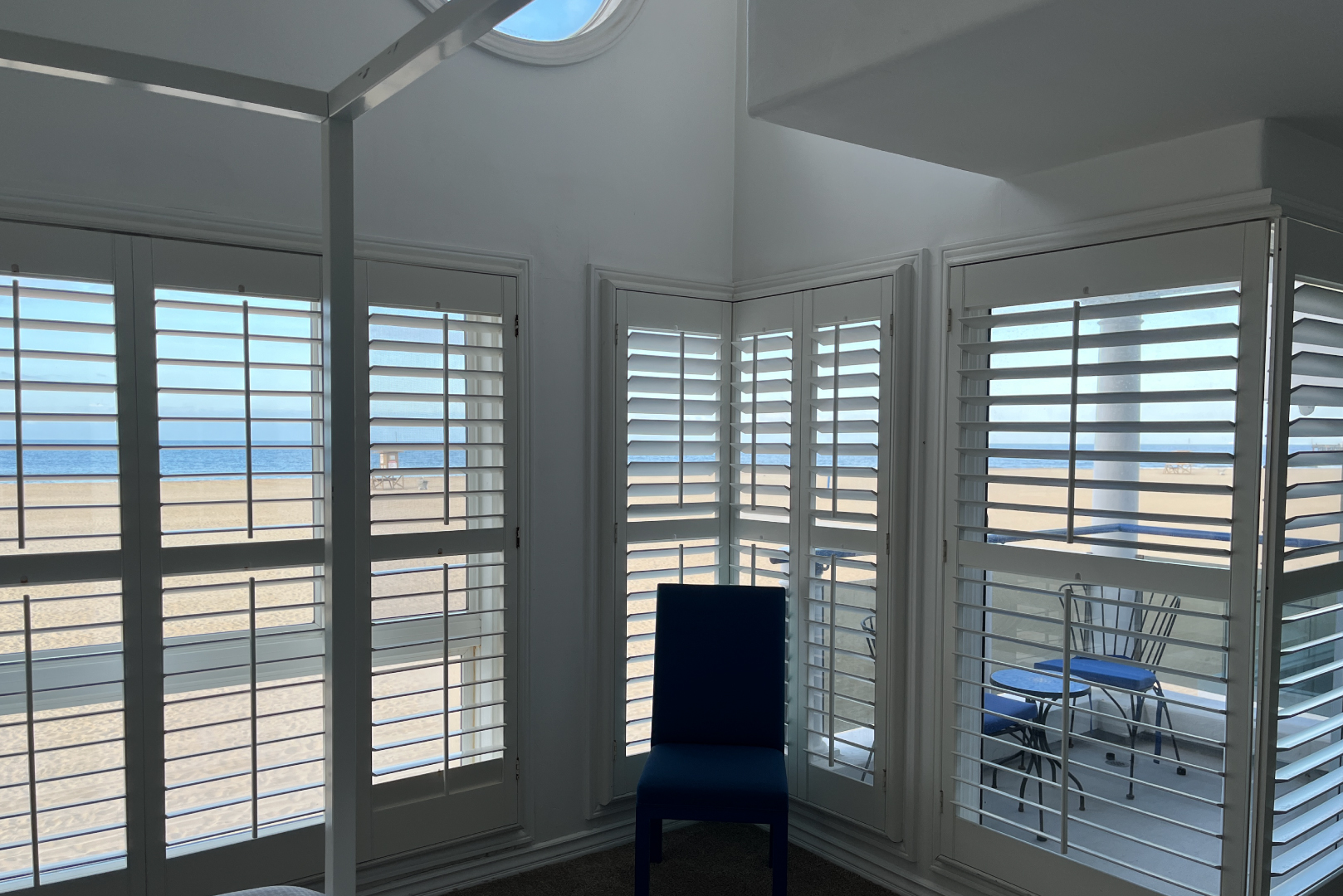 A view of the primary bedroom with ocean view