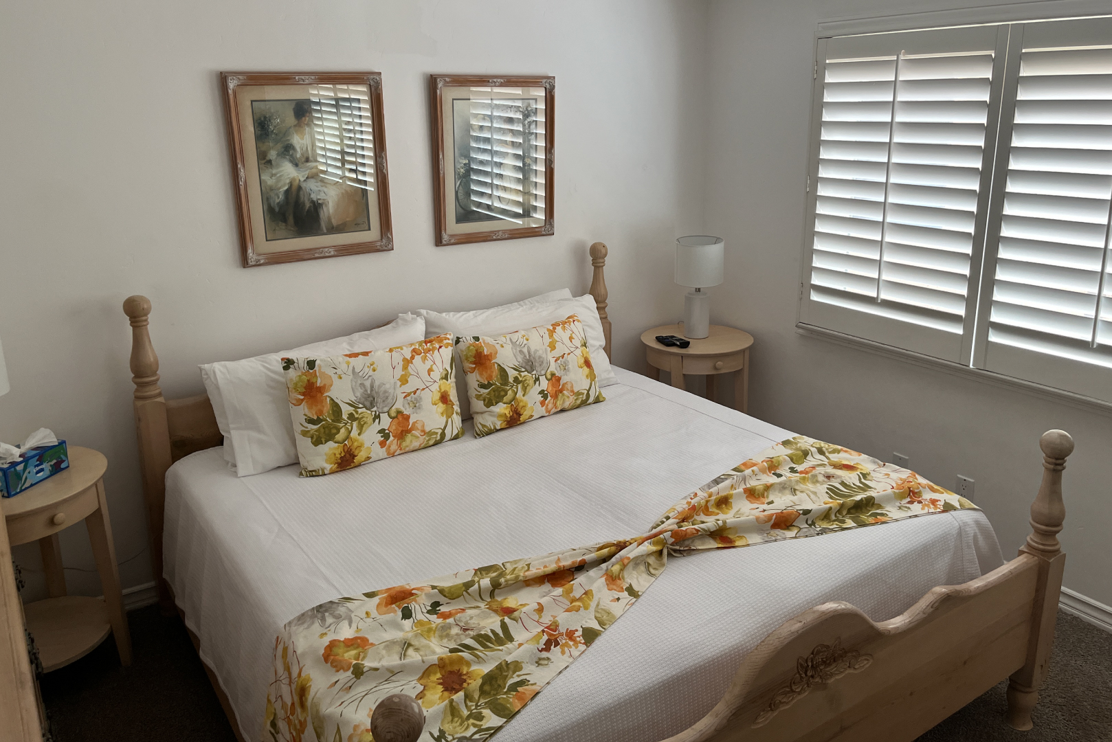 A view of guest room 1. Contains a King sized bed