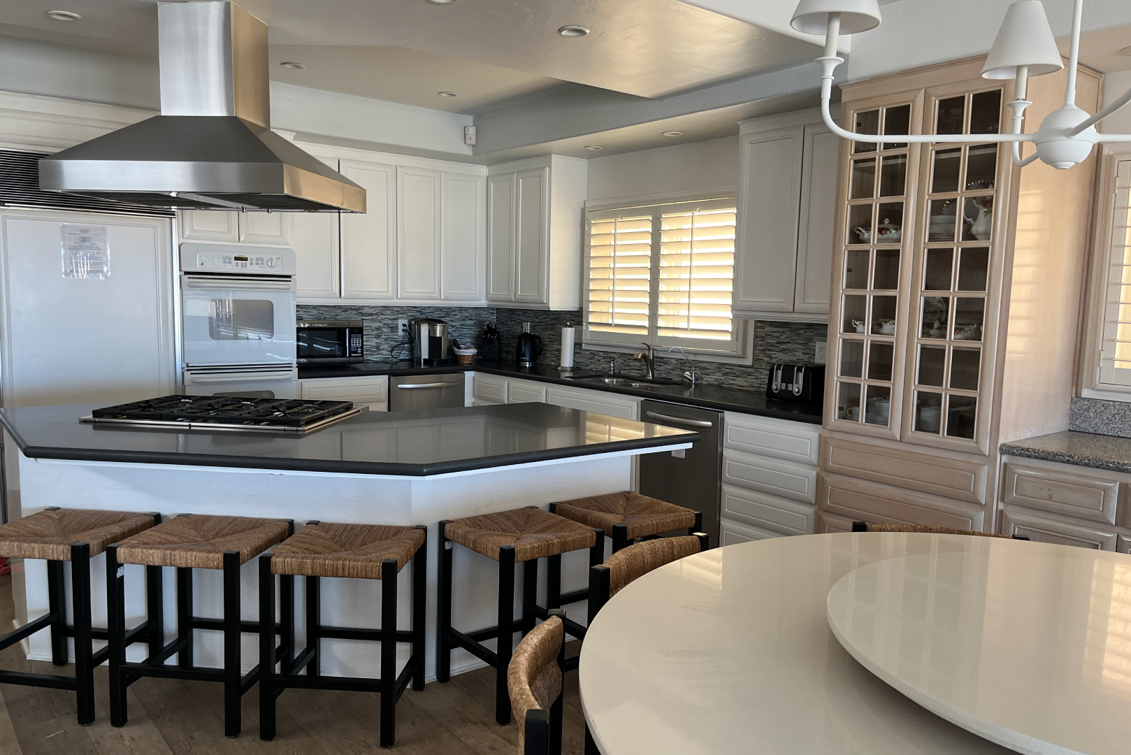 A view of the kitchen and dining room table