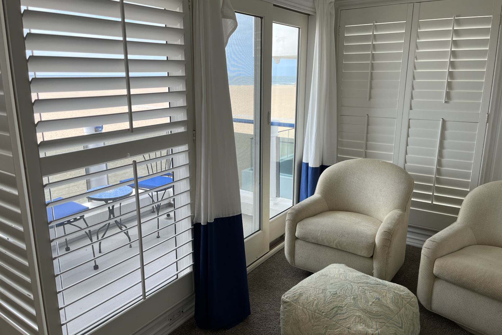 A view of the primary bedroom with ocean view