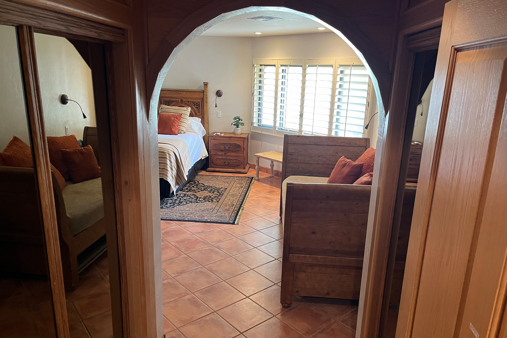 The primary bedroom contains a Queen sized bed and a day bed