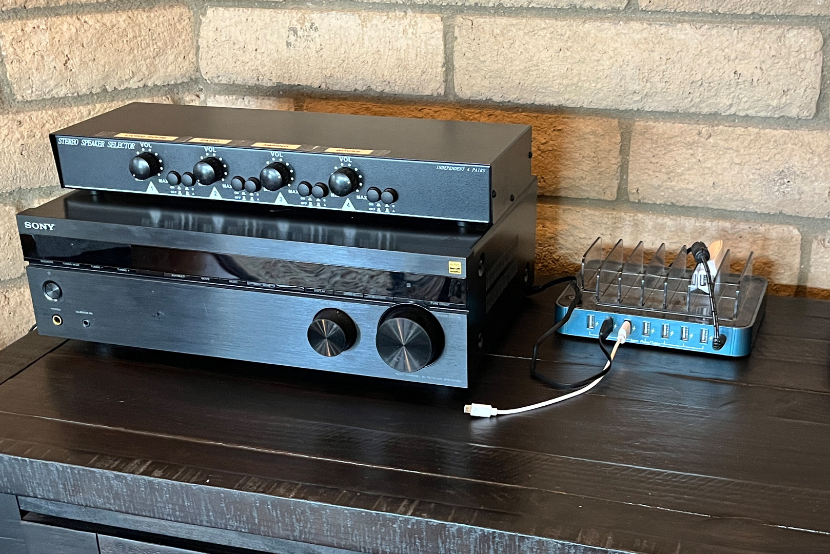 A view of the Sony bluetooth stereo system, speaker controls and phone charging station